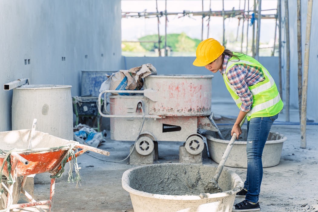 New Jersey contractor inspecting freshly poured concrete to check installation and concrete quality