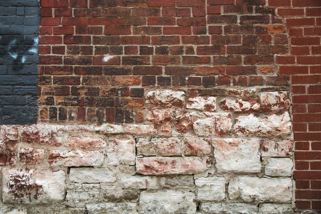 Cracked brick and mortar joints on a residential home in New Jersey caused by freeze-thaw damage