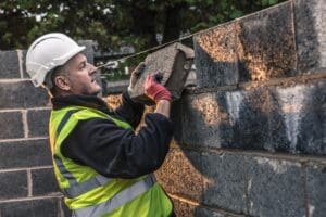 What Homeowners Should Know About Masonry Maintenance in NJ 1 Professional masonry maintenance work on a New Jersey home preserving brickwork and structural integrity