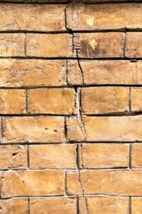 What Causes Masonry Cracks and How Are They Fixed? 1 cracked brick wall restoration by Pete’s Concrete & Masonry NJ