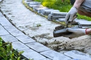 Stone walkway construction completed during ideal weather conditions by Pete's Concrete & Masonry in New Jersey